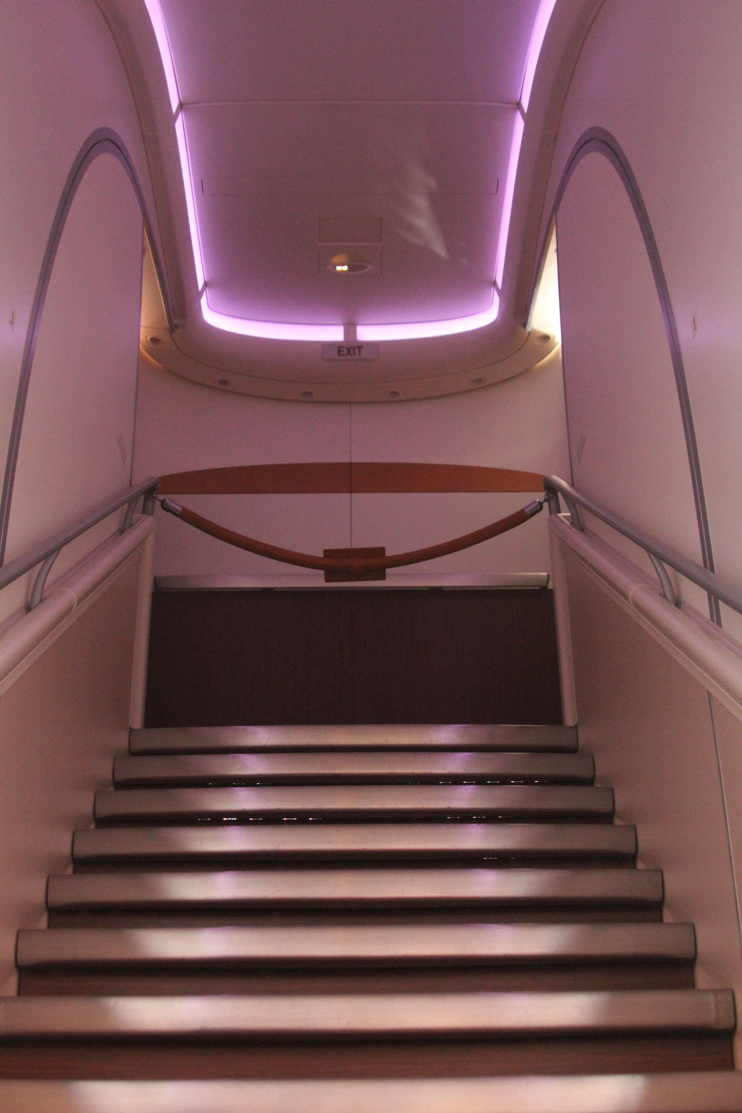 a staircase with a purple light