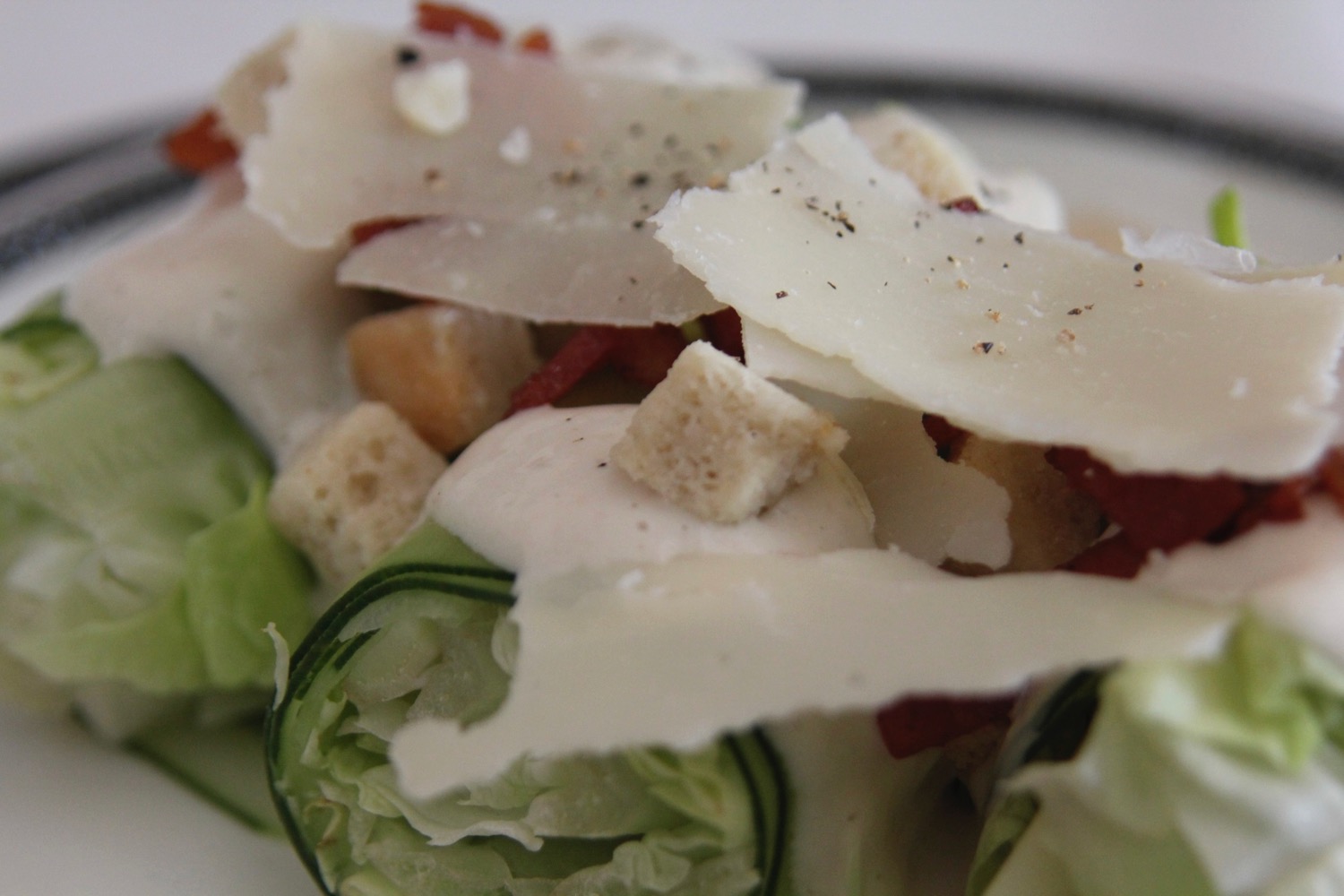 a salad with cheese and croutons