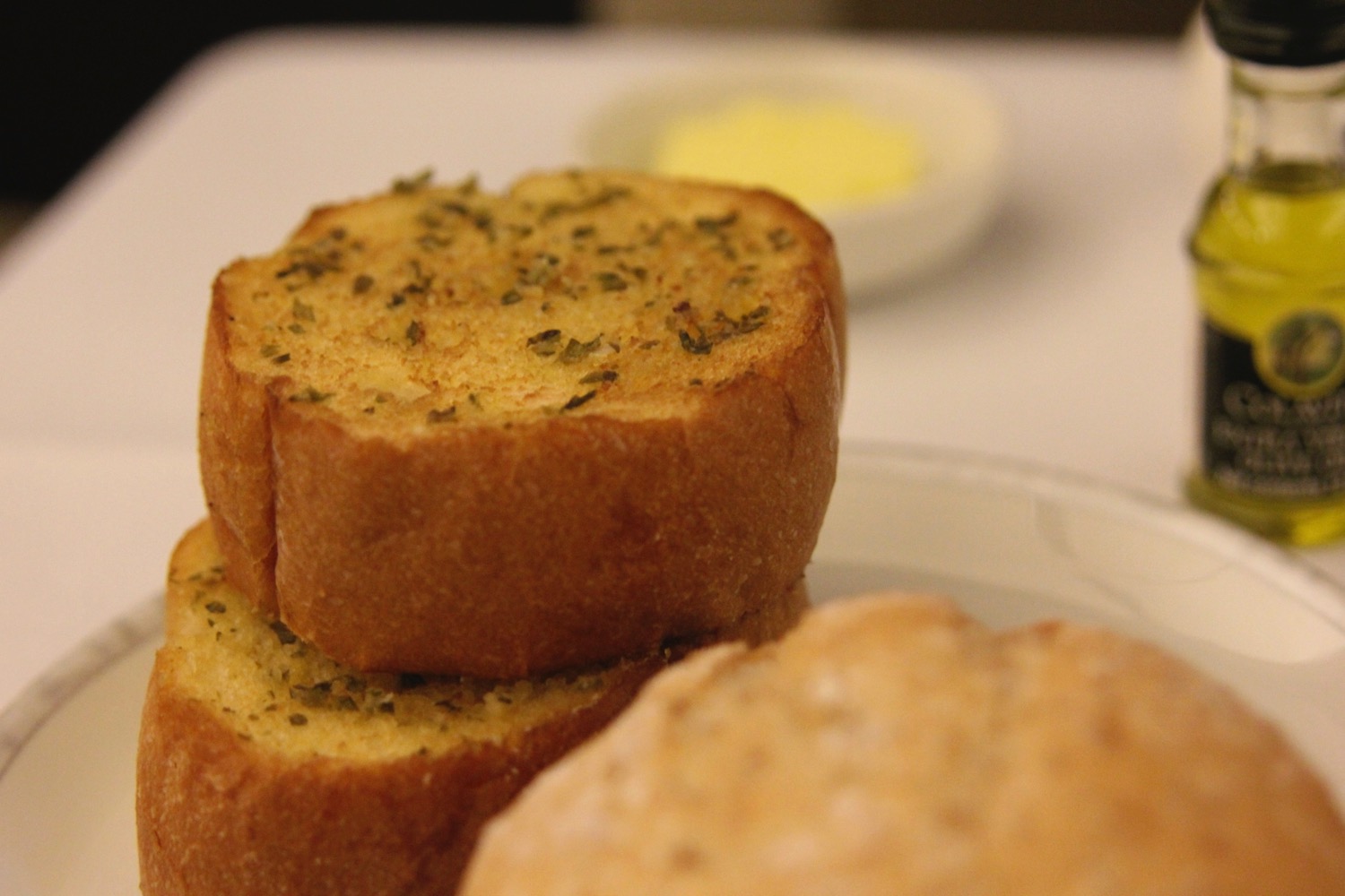 a stack of bread with herbs on top