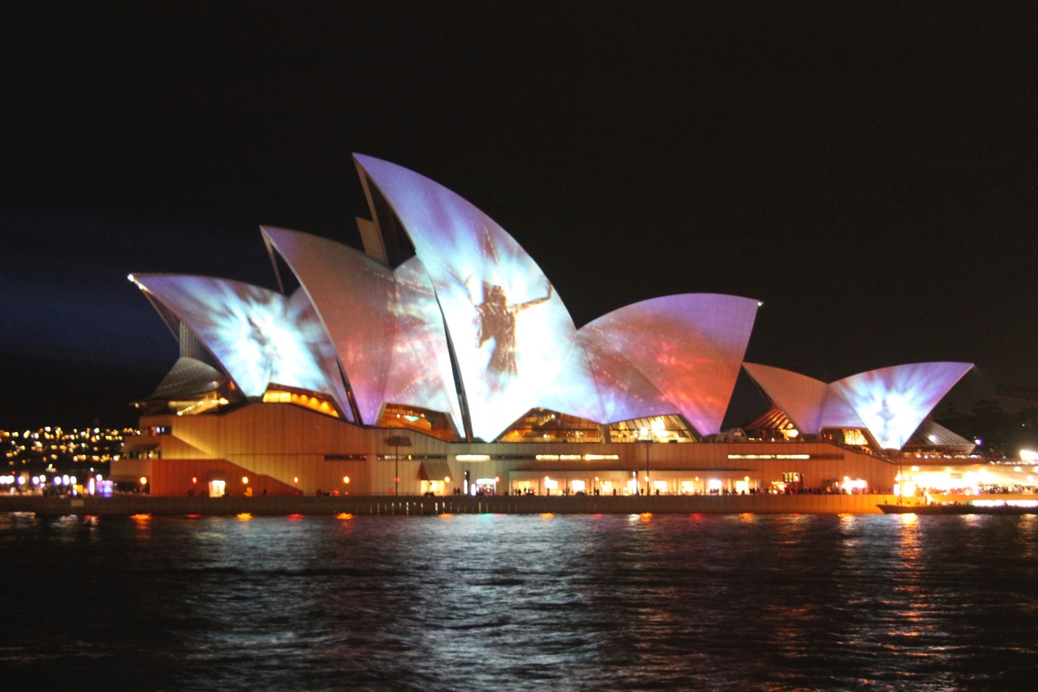 Sydney Opera House with lights on it