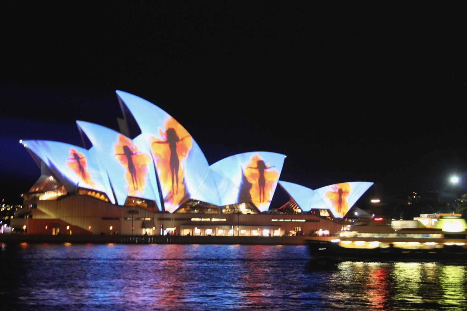 Sydney Opera House with a large structure with a group of people on it