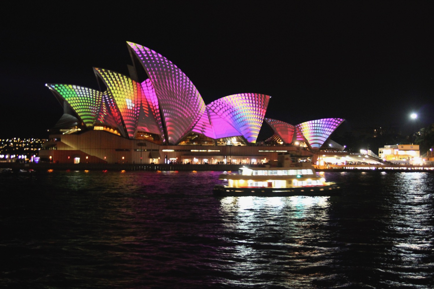 Sydney Opera House with colorful lights on it