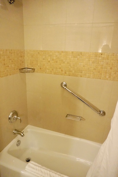 Ugh, shower over tub - there was enough space in the bathroom for both