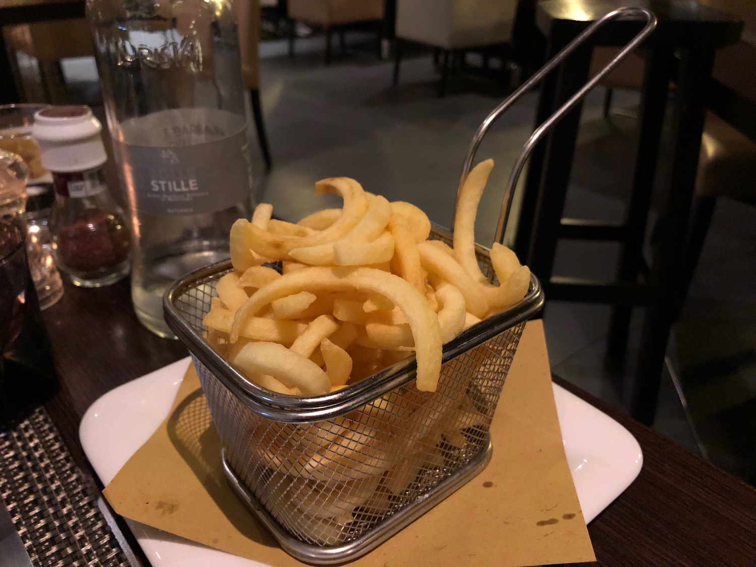 a basket of french fries on a plate