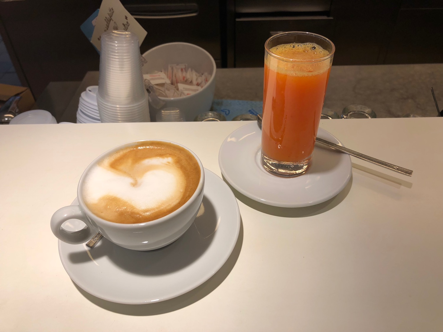 a cup of coffee and a glass of juice