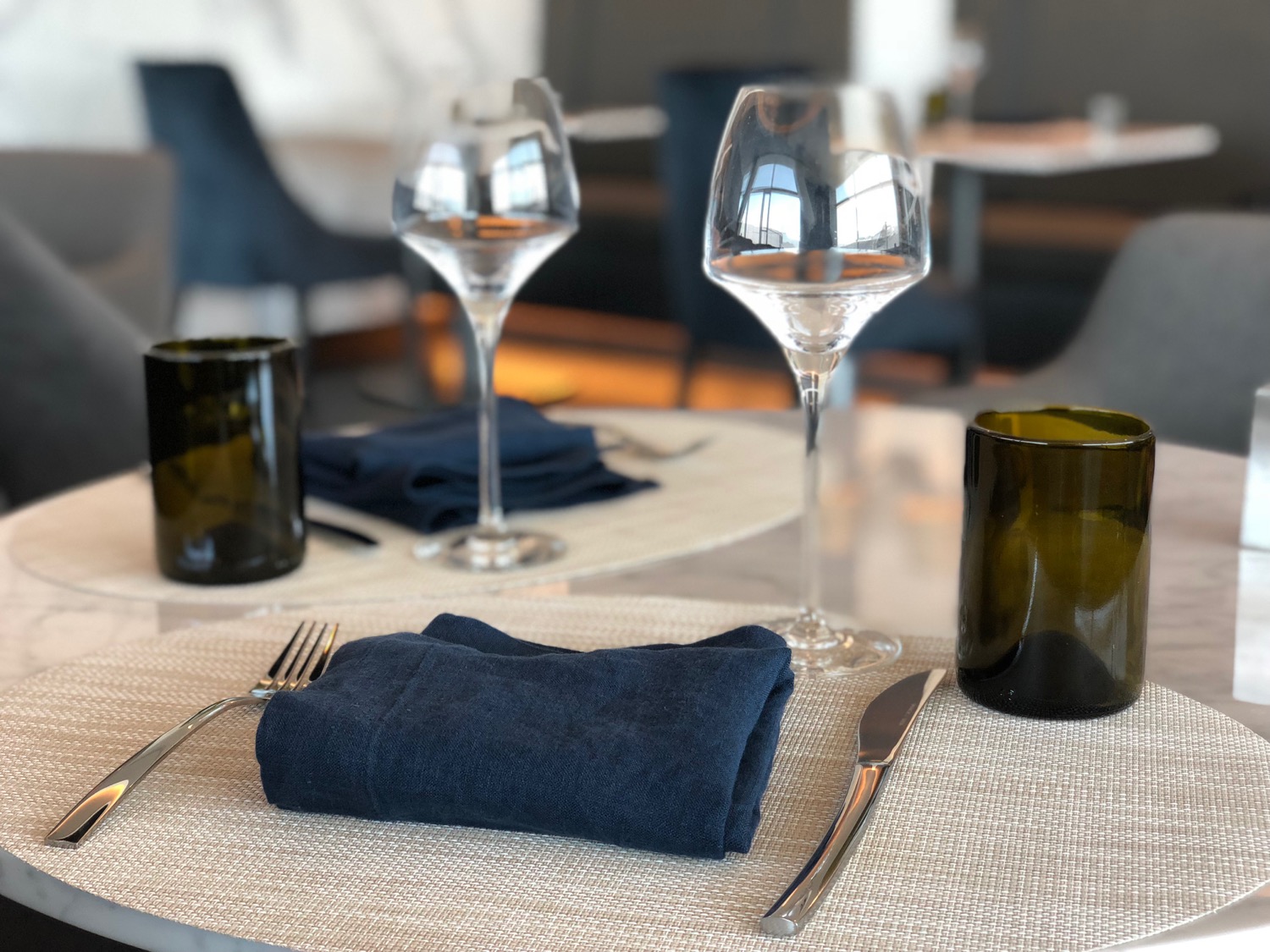 a table with glasses and a napkin on it