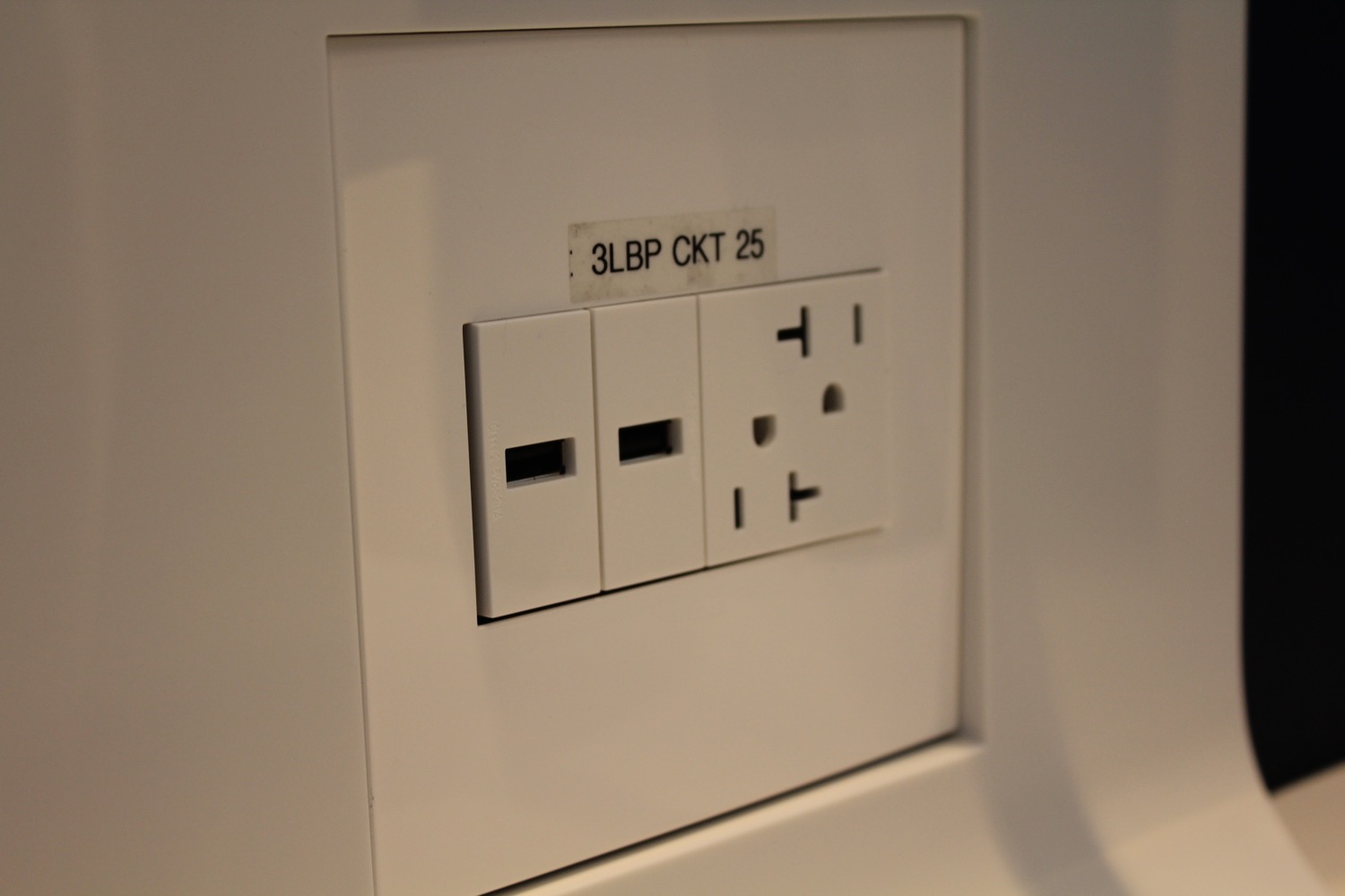 a white outlet with two outlets