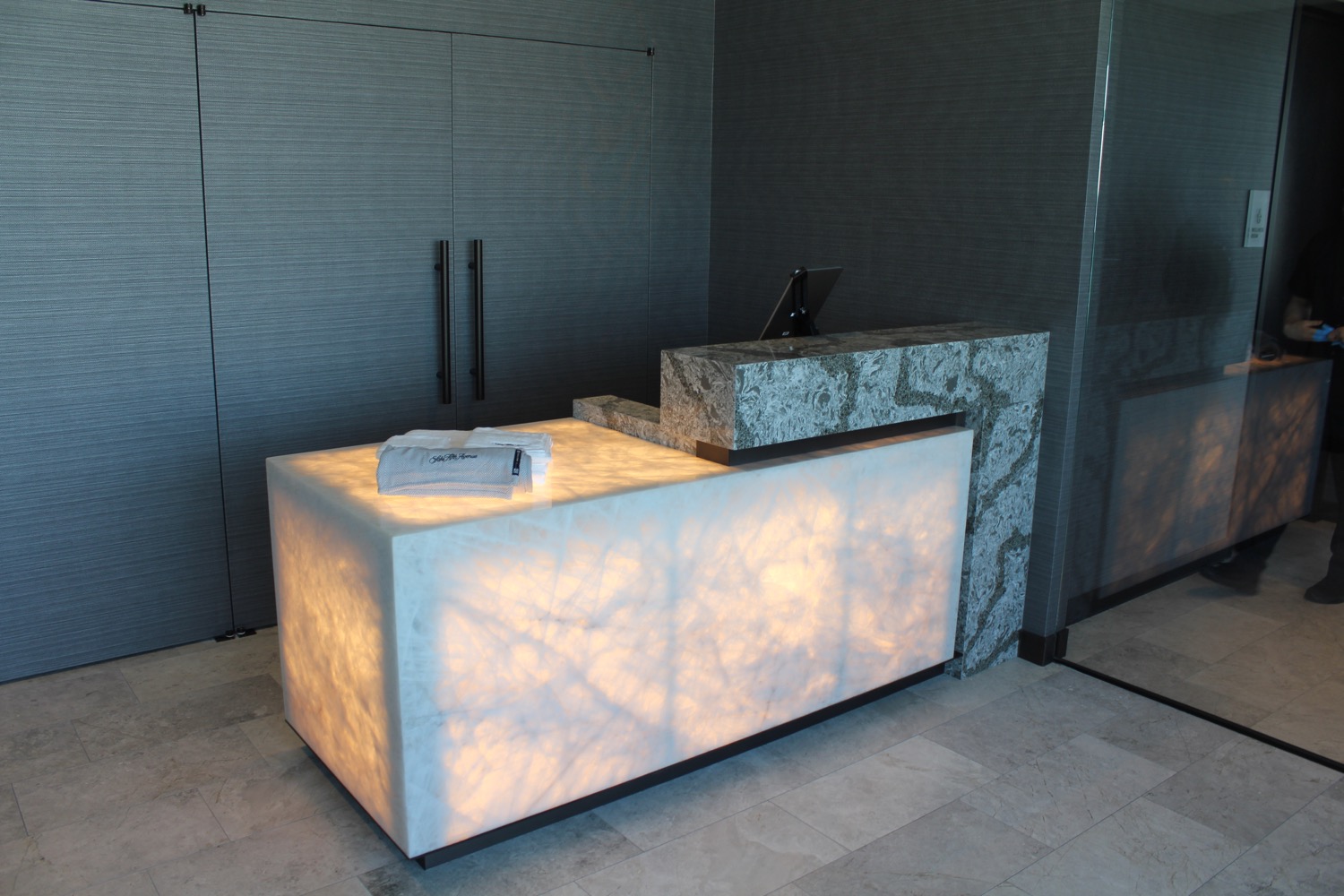 a marble counter with a light on top