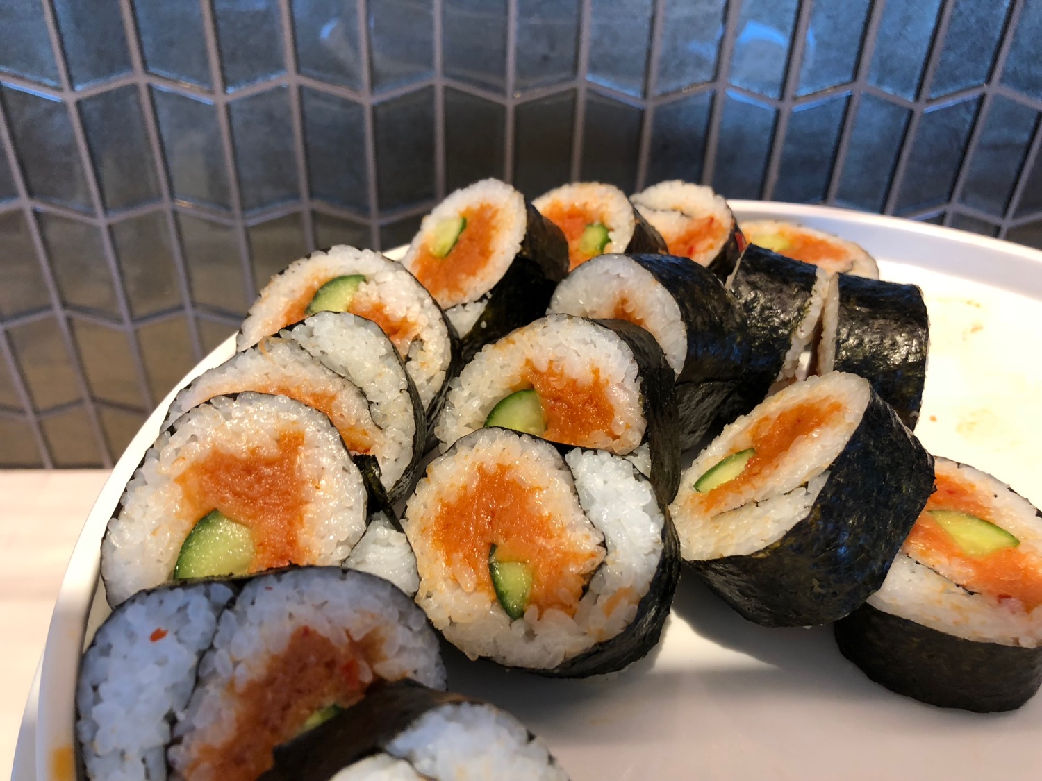 a plate of sushi rolls