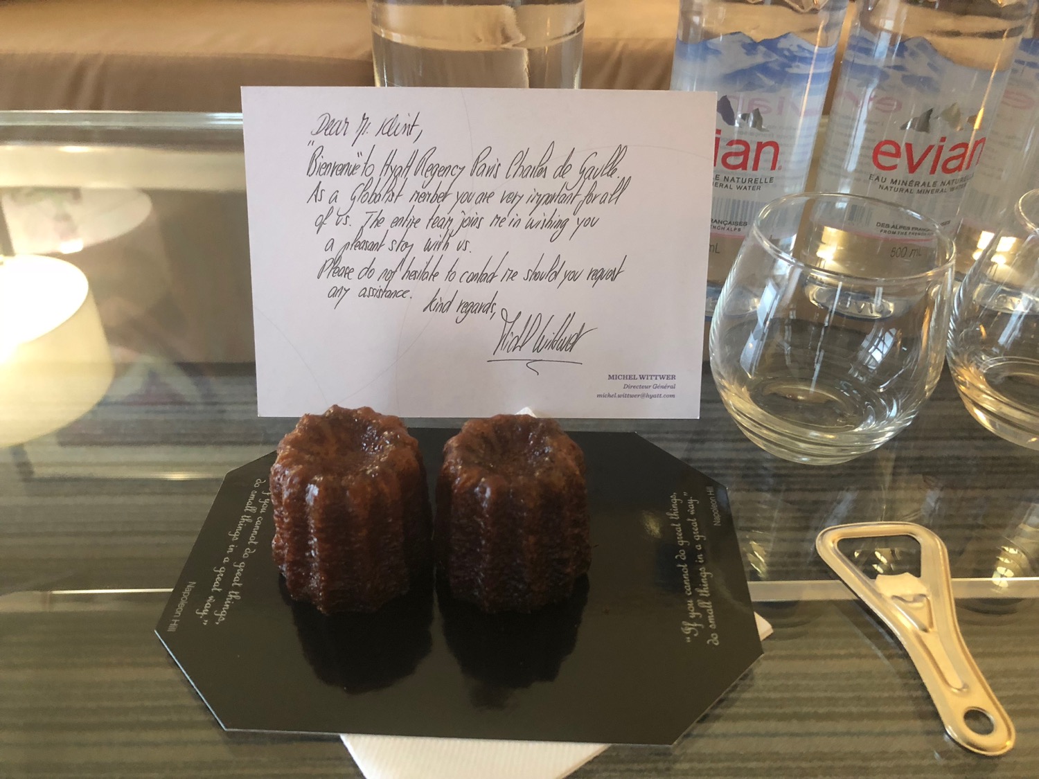 a small chocolate dessert on a table with a note