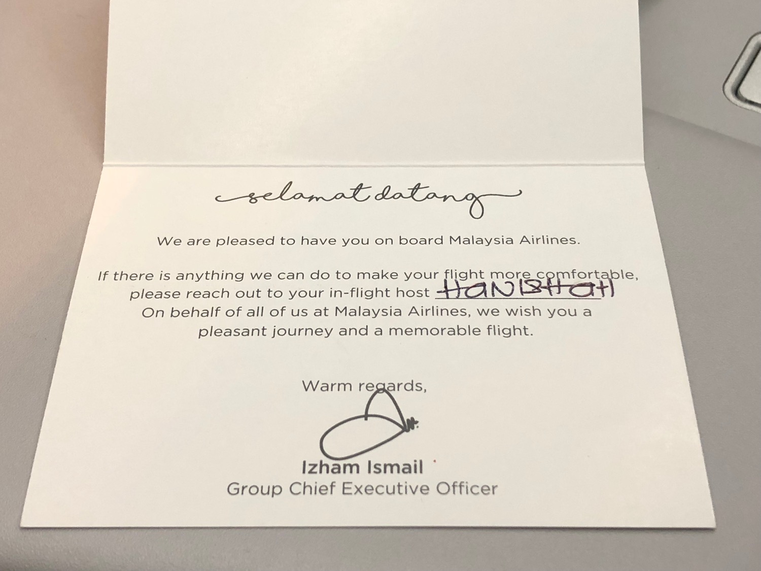 a white card with black writing on it