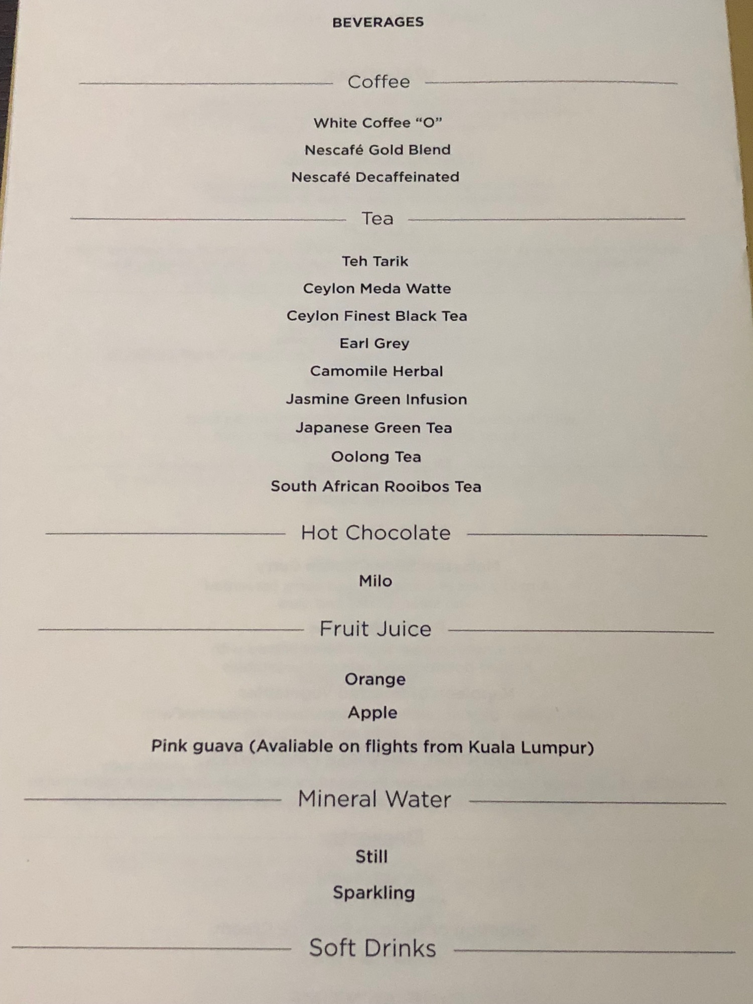 a menu of drinks on a table