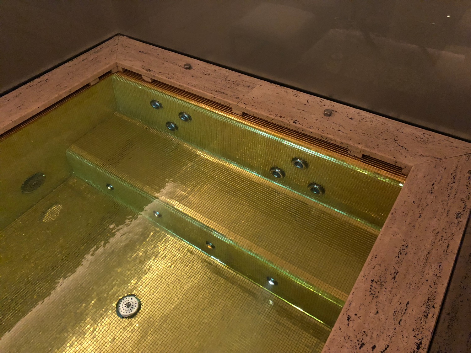 a gold water in a bathtub