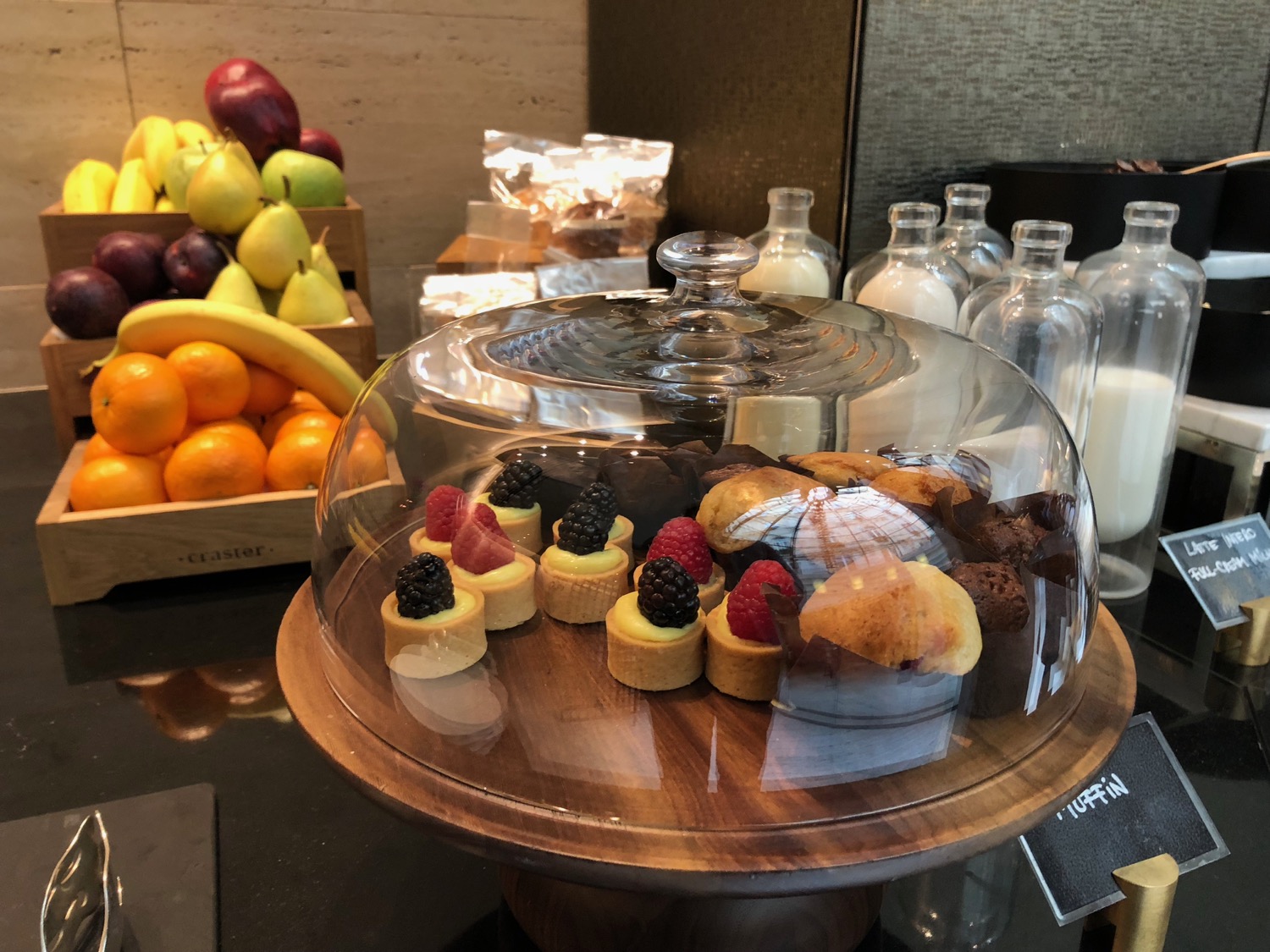 a tray of pastries and fruit on a table