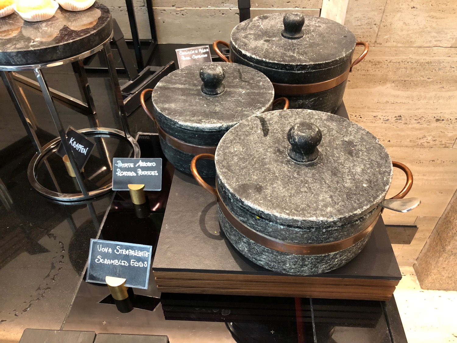 a group of pots on a shelf