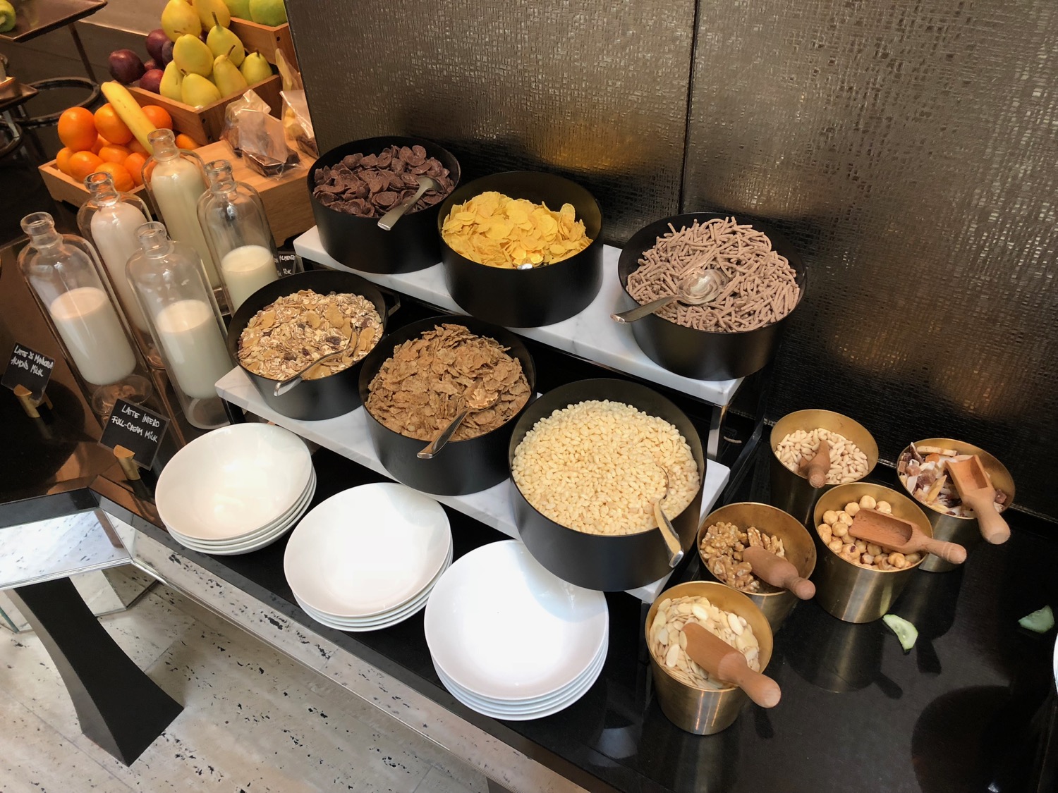 a buffet with bowls of cereal and bowls of food