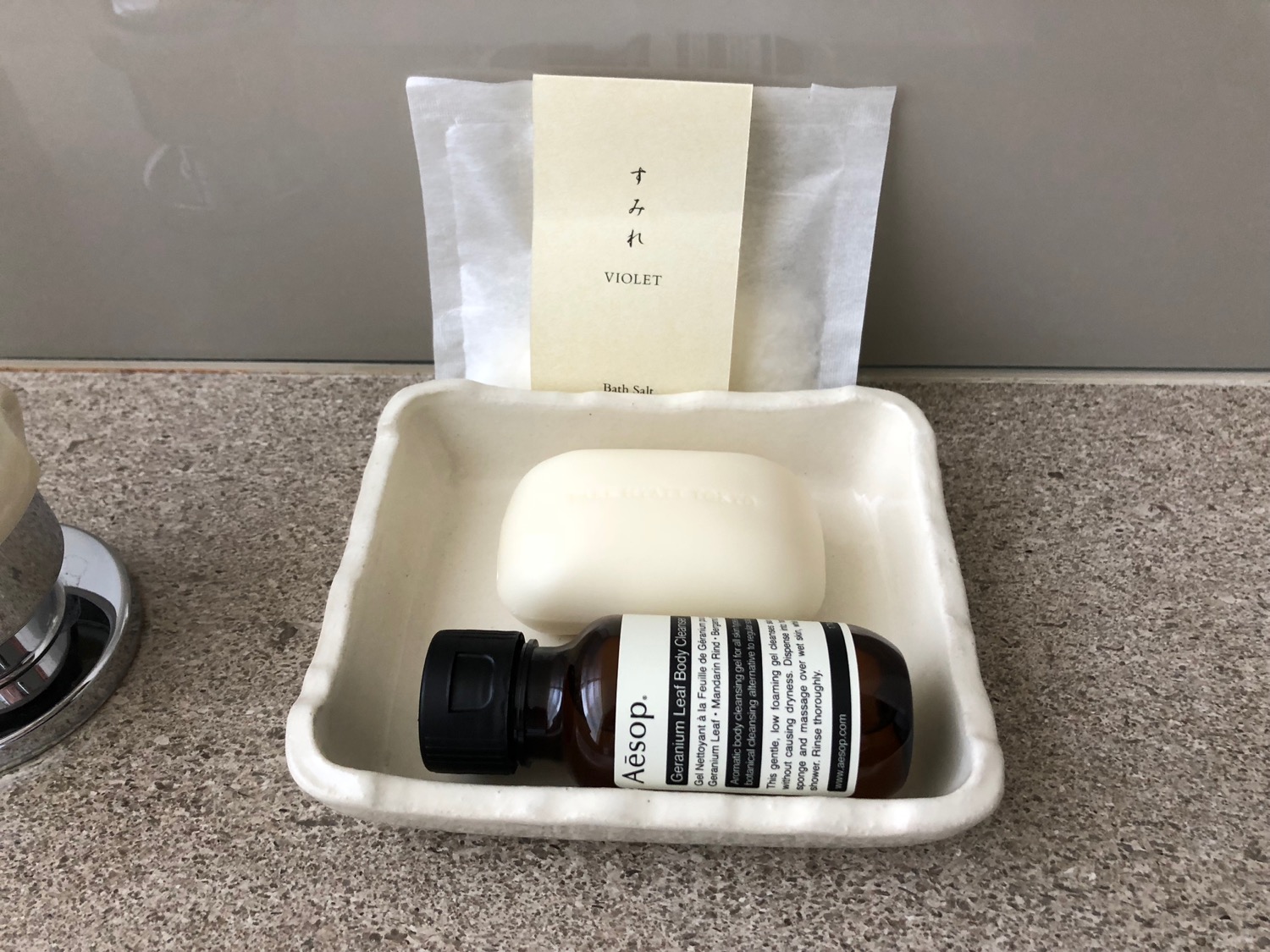 a soap and a bottle in a container