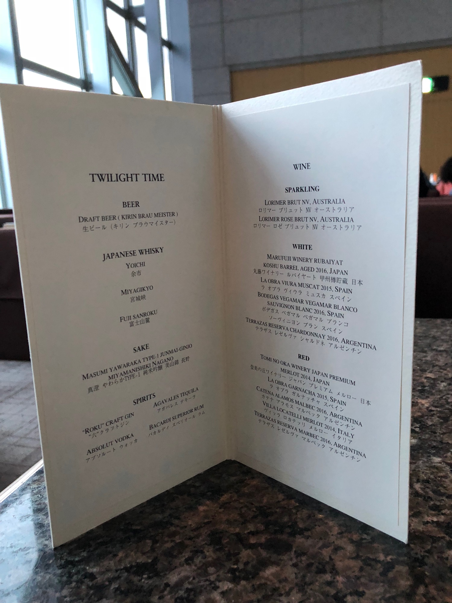 a menu on a marble table