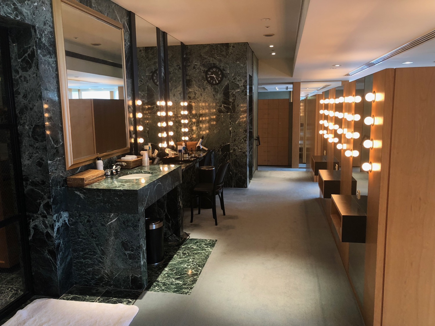 a bathroom with a mirror and lights