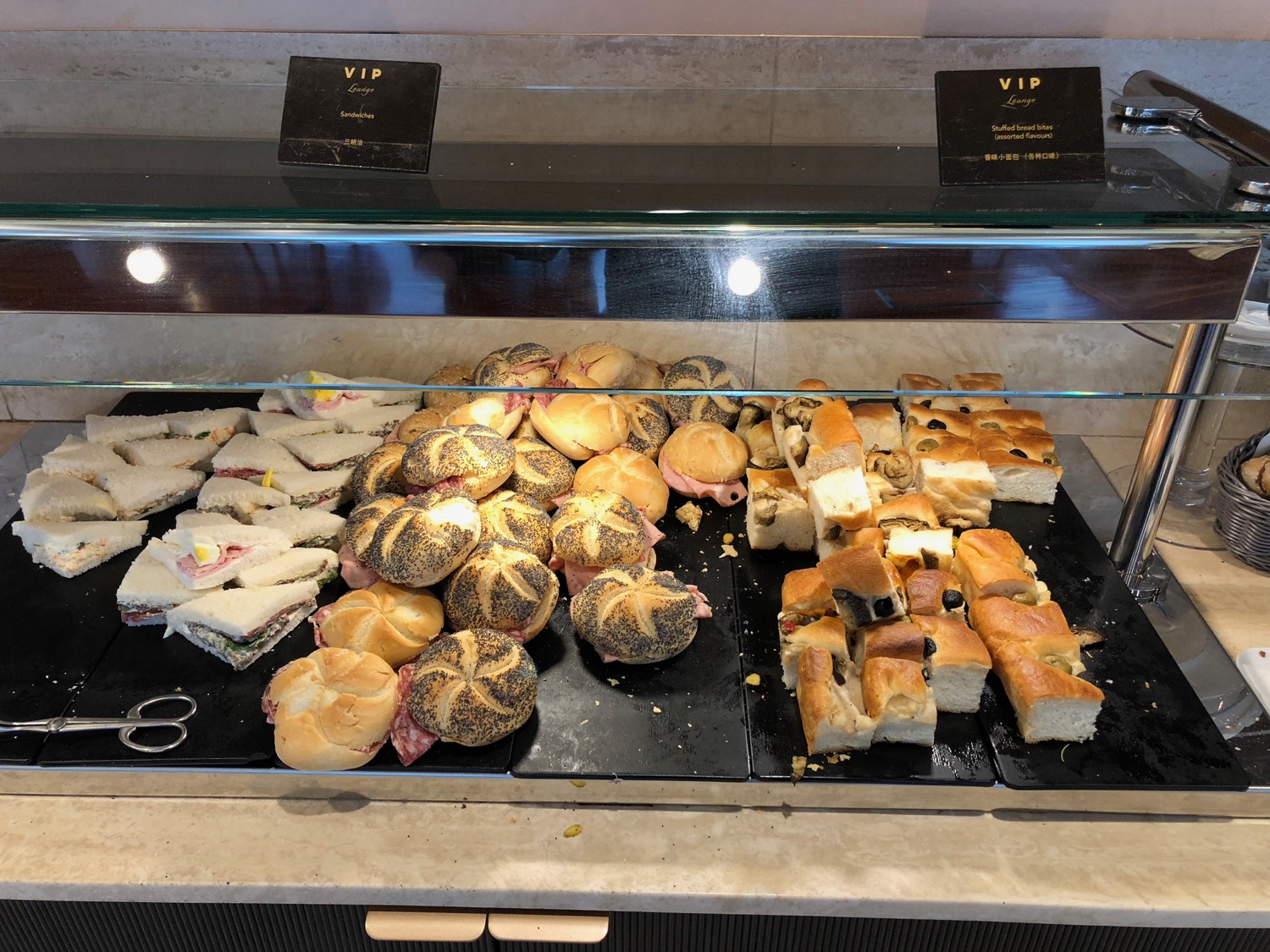 a display case of sandwiches and sandwiches
