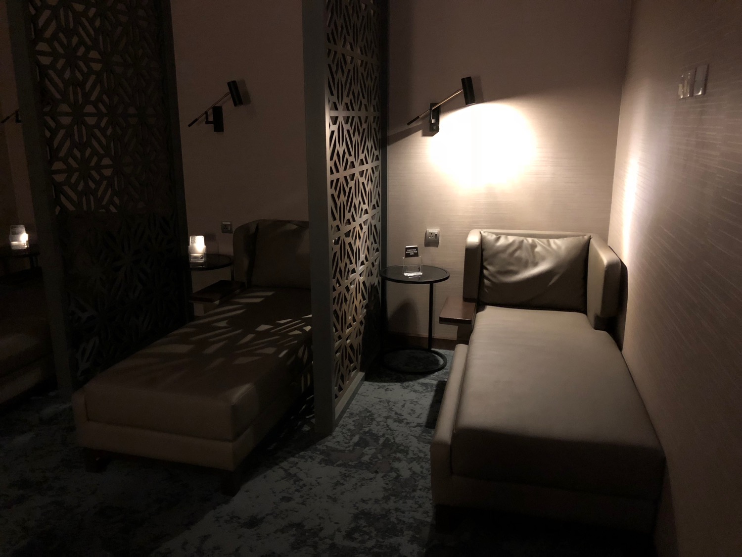 a room with couches and a wall