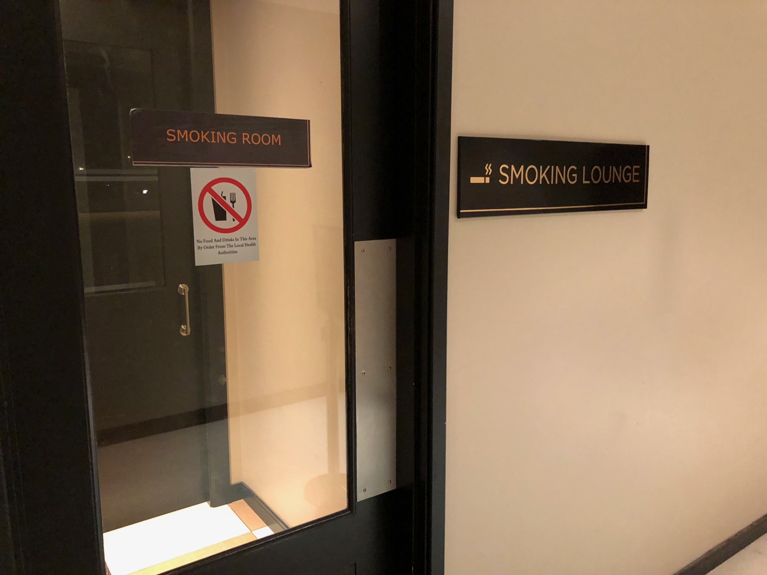 a door with a glass door and a sign