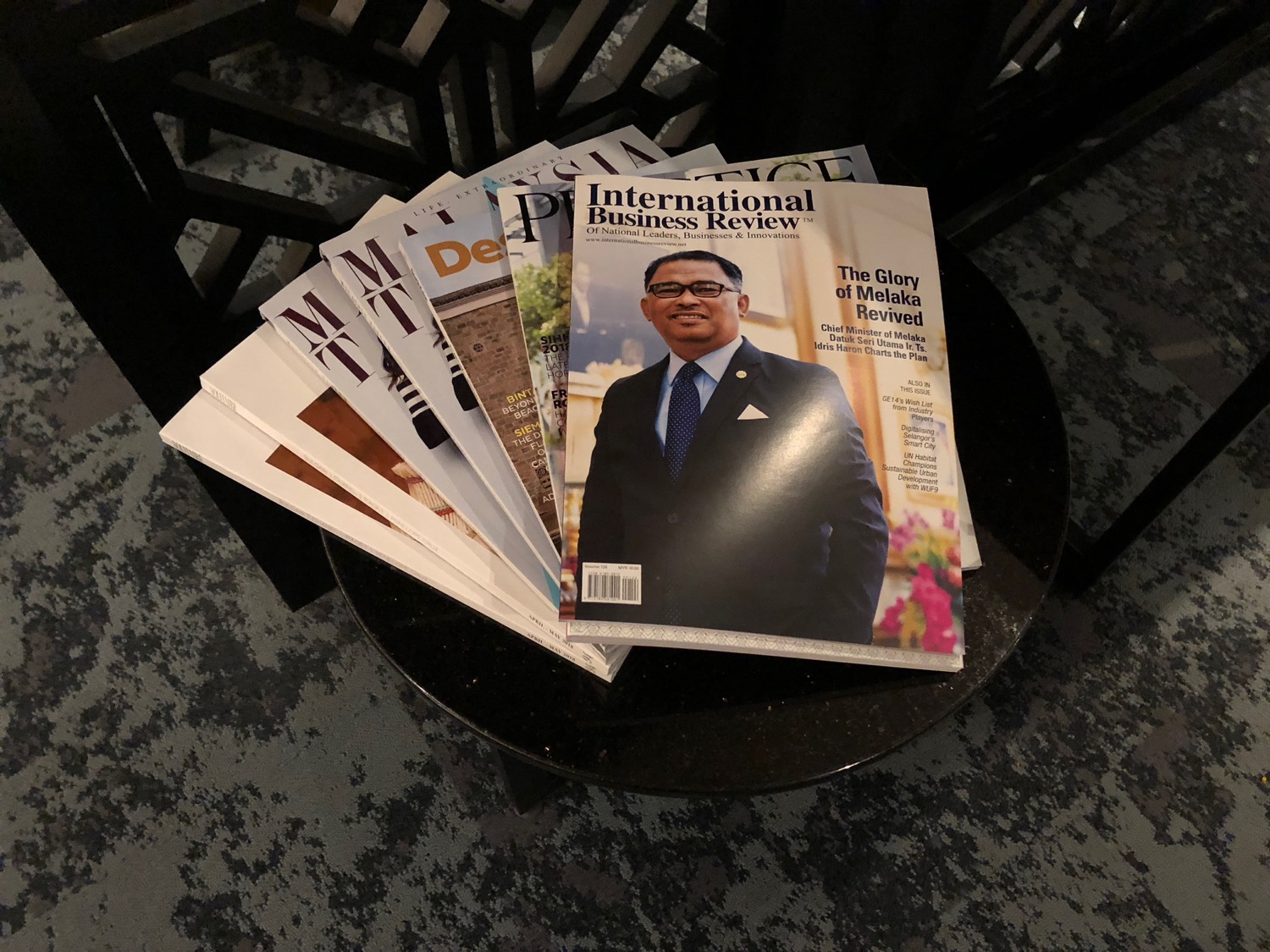 a group of magazines on a table