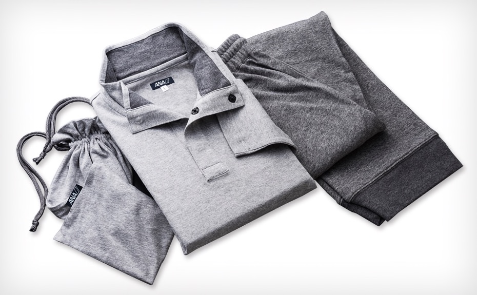 a folded grey shirt and pants