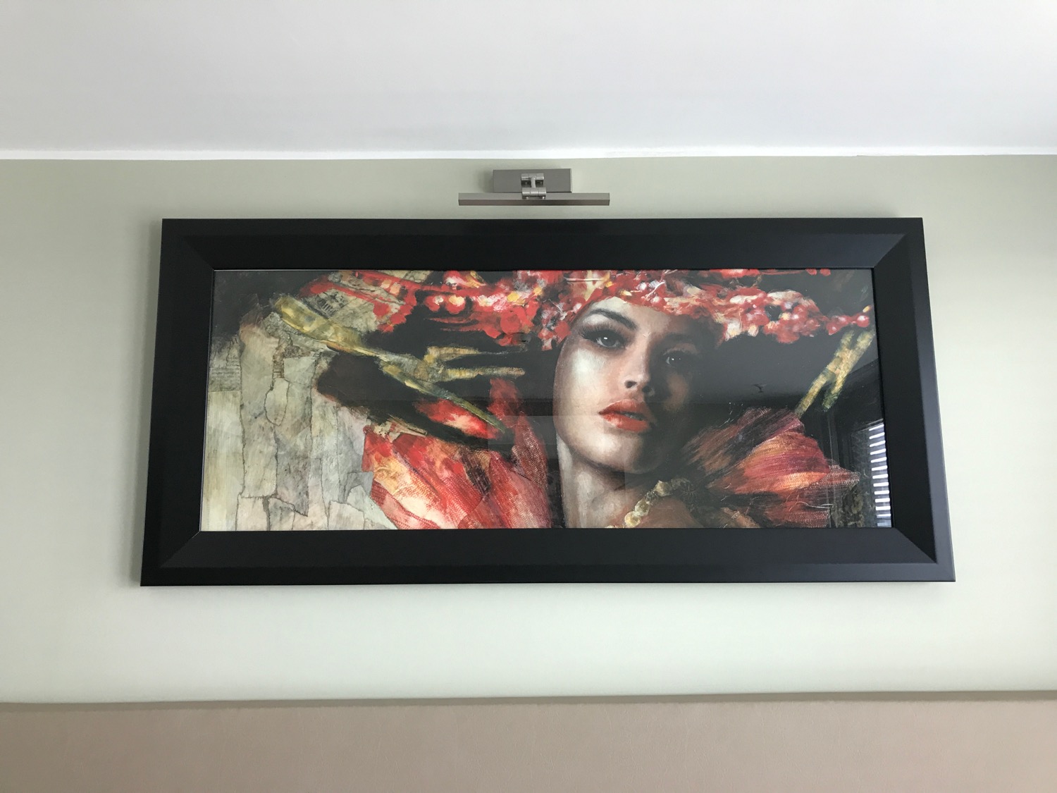 a framed picture of a woman in a flower crown