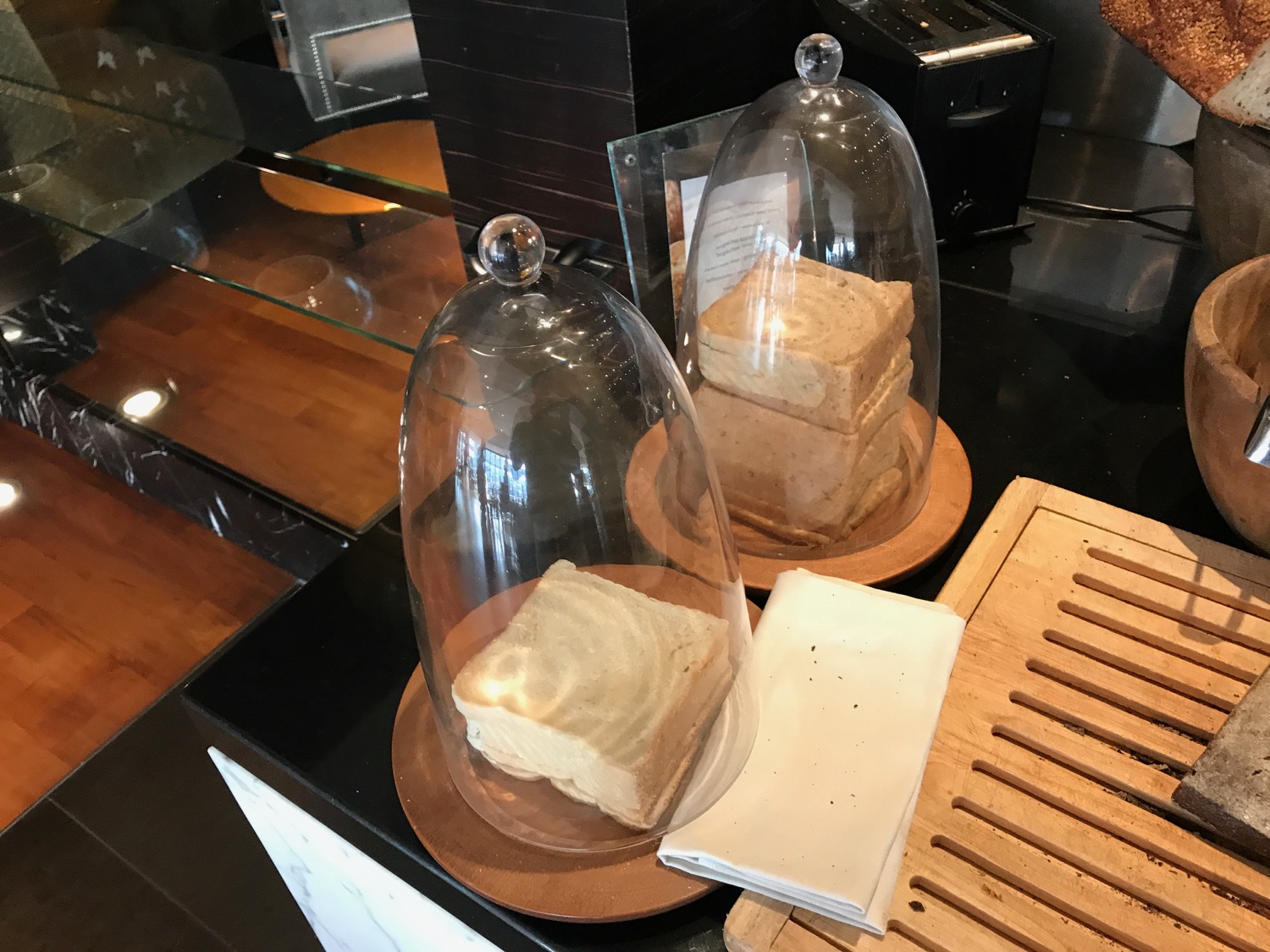 a couple of bread cloches on a counter