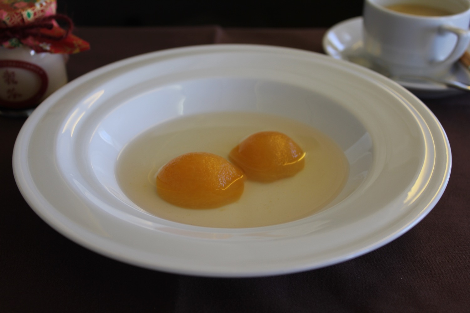 a plate of food with two oranges in it