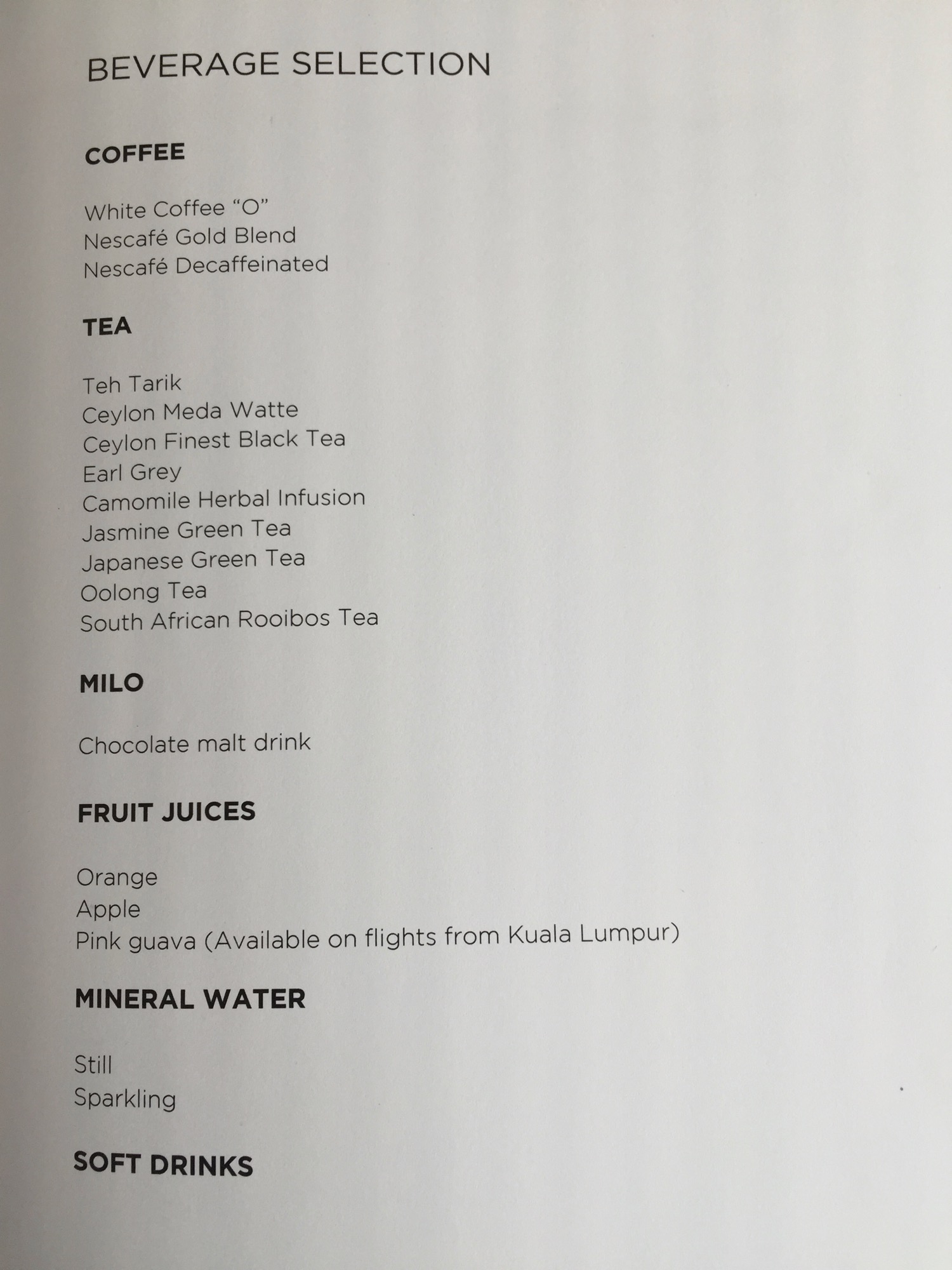 a menu of drinks on a white surface