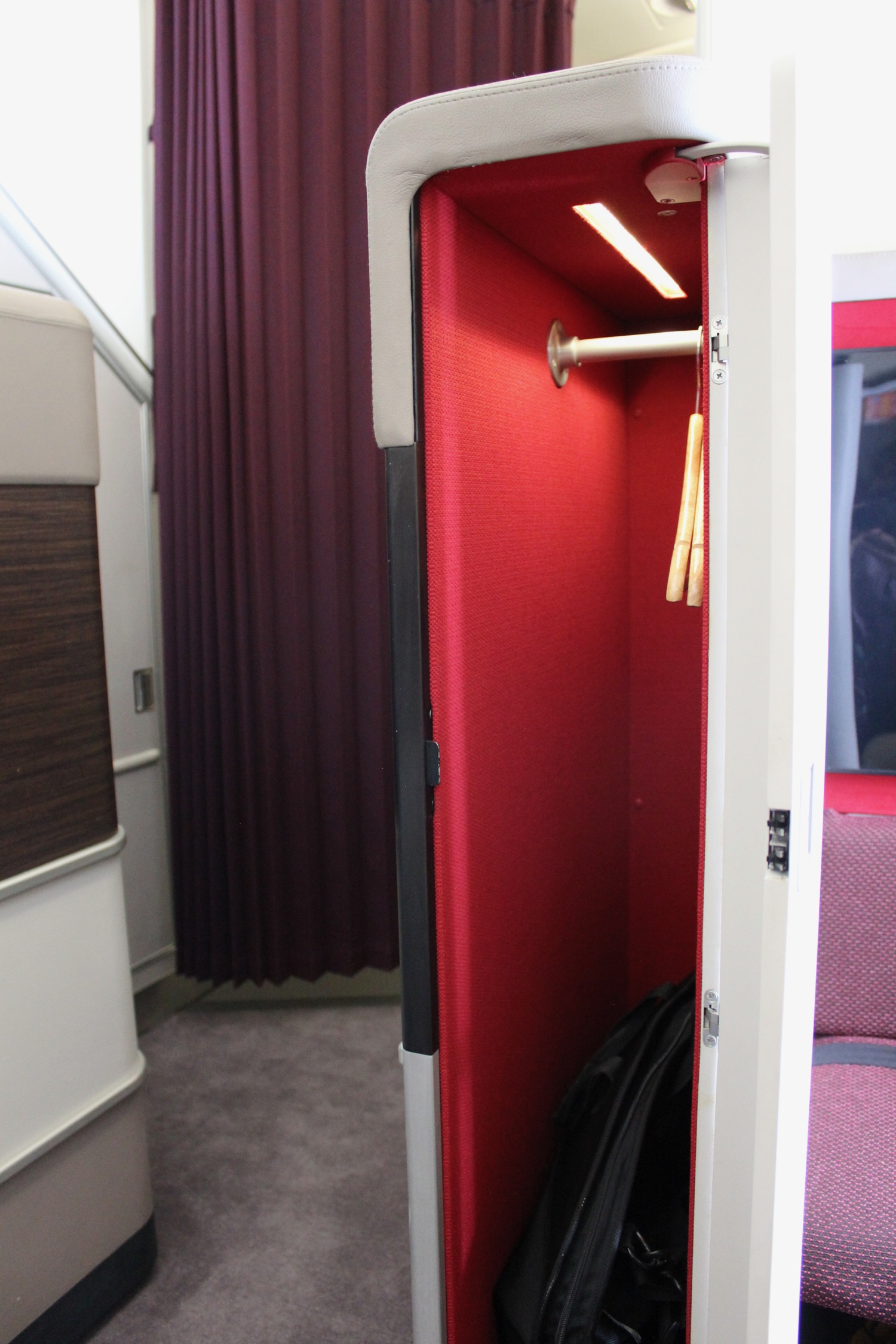 a closet with a red cloth and a curtain