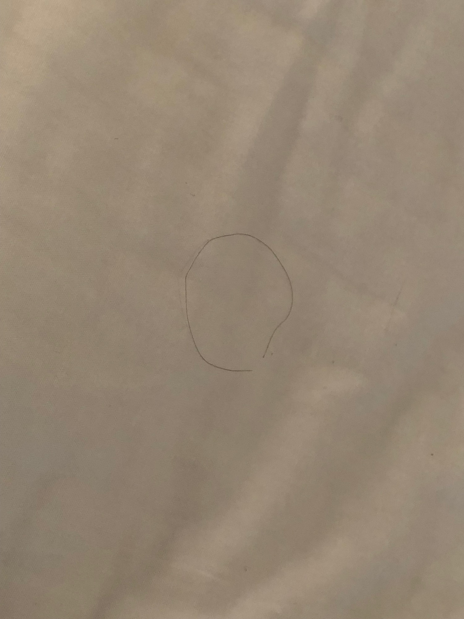 a circle drawn on a white surface