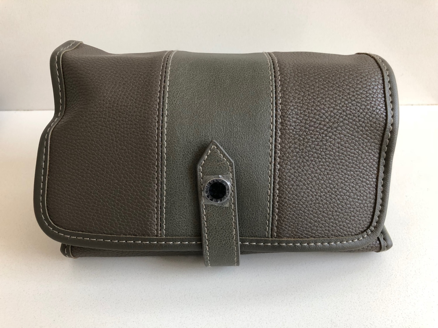 a brown and grey leather purse