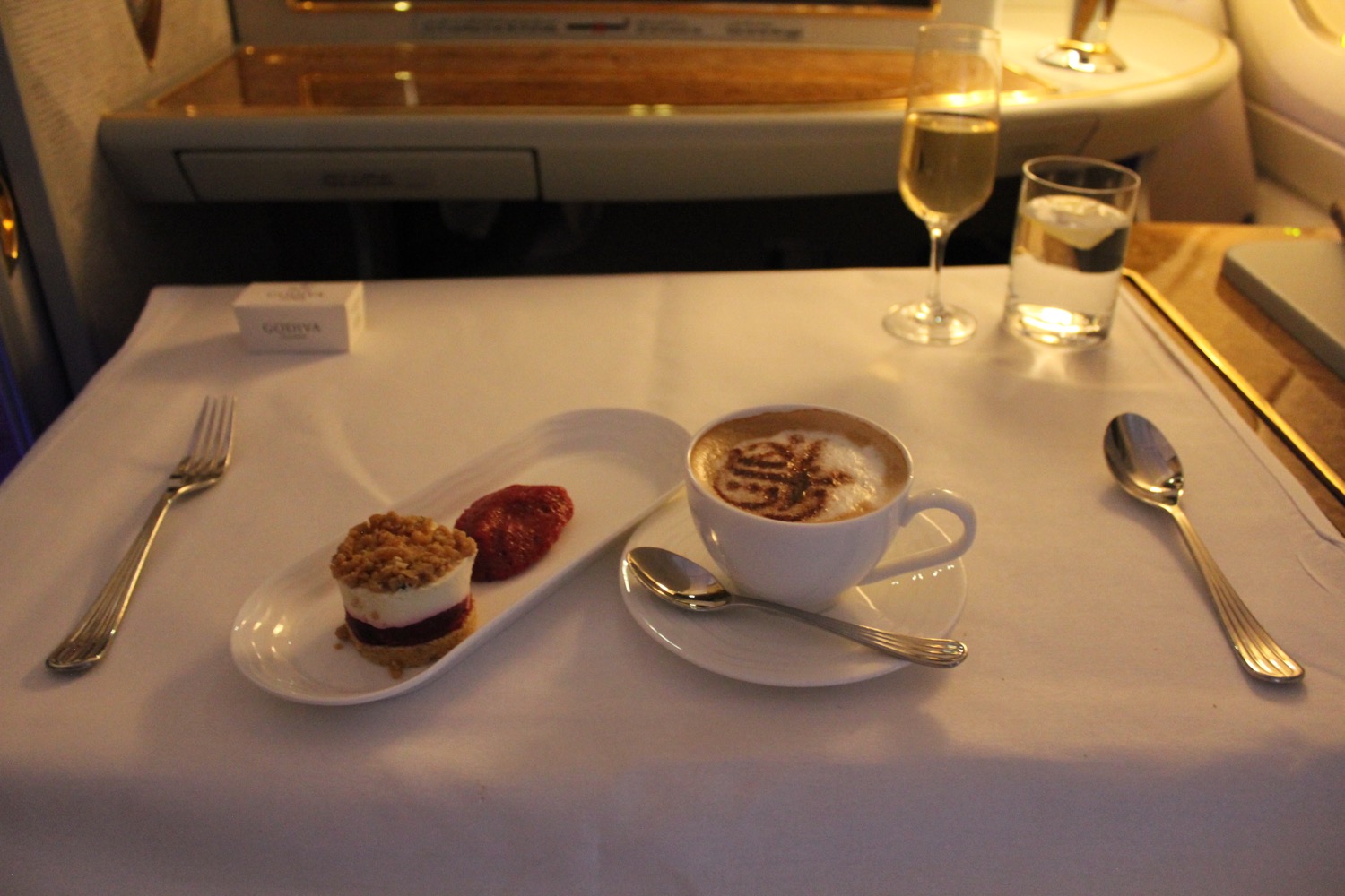 a plate of dessert and a cup of coffee on a table