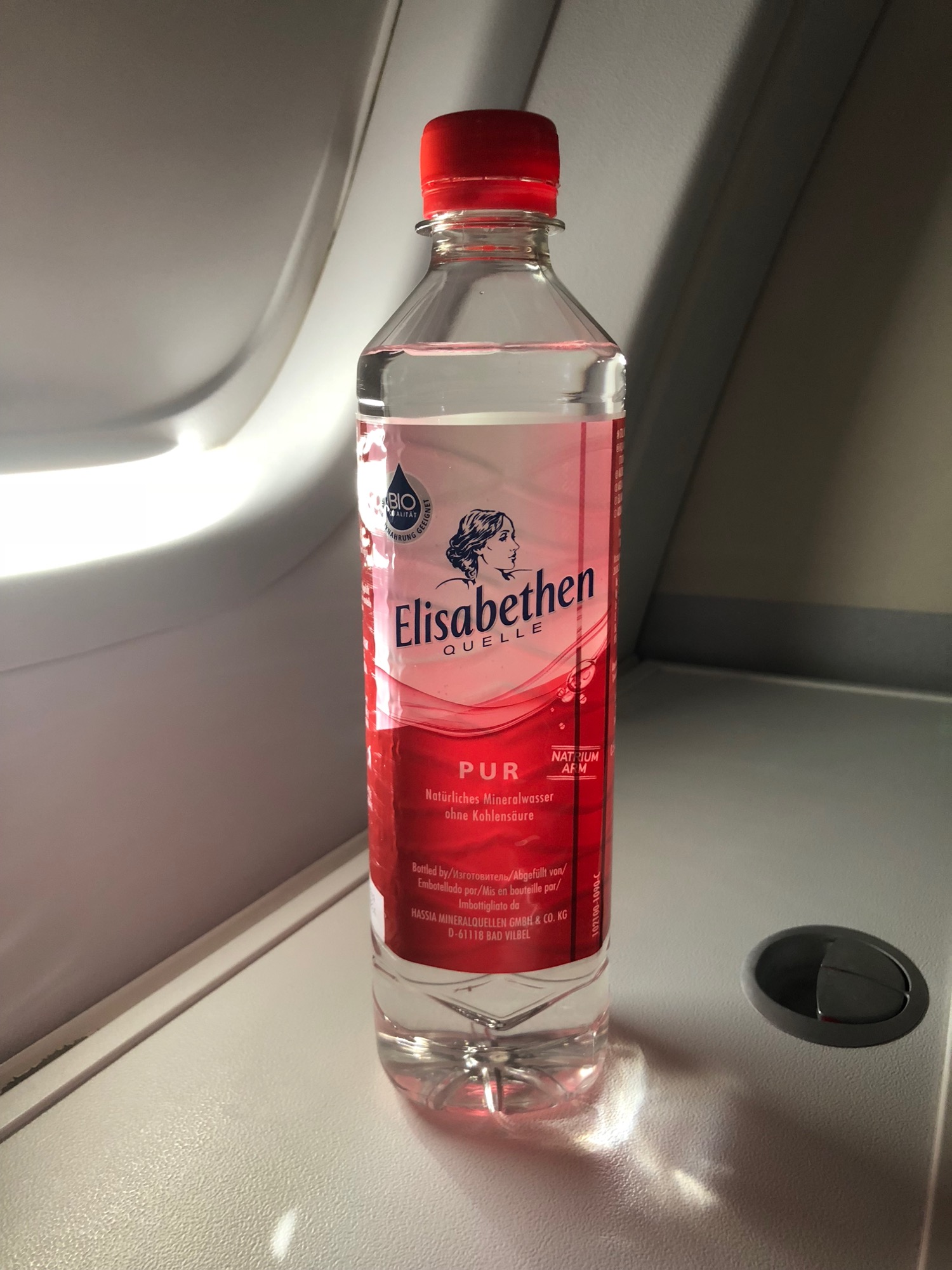 a bottle of liquid on a plane