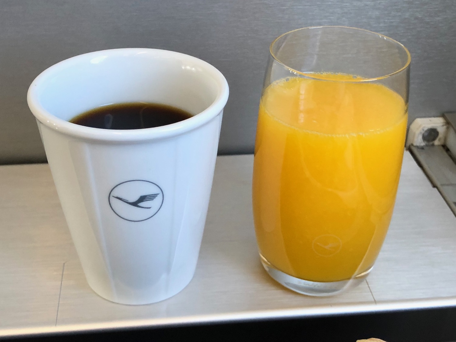 a cup of coffee and a glass of orange juice