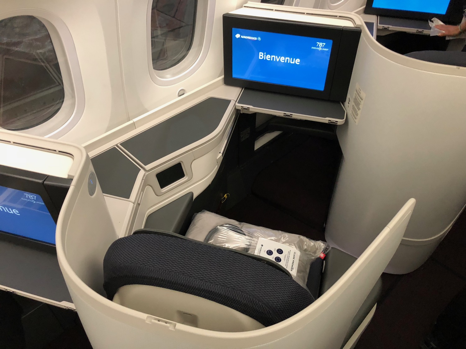 a seat with a monitor in the middle of the seat