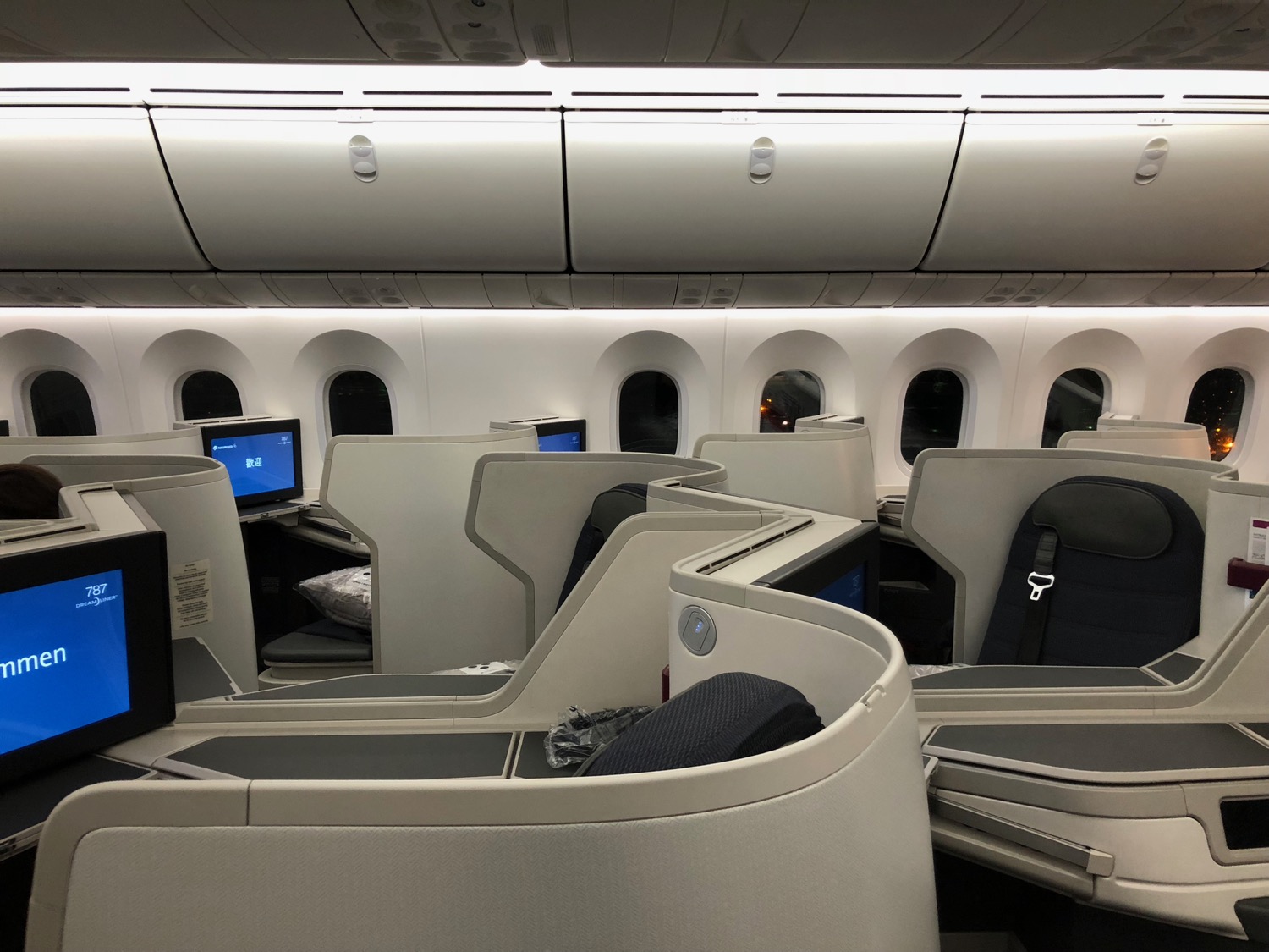 an airplane with rows of seats and windows