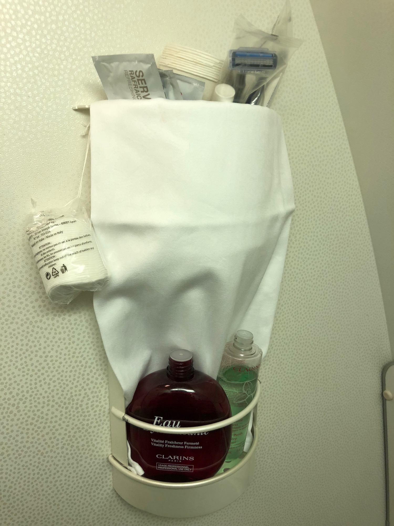 a white towel and a bottle of shampoo