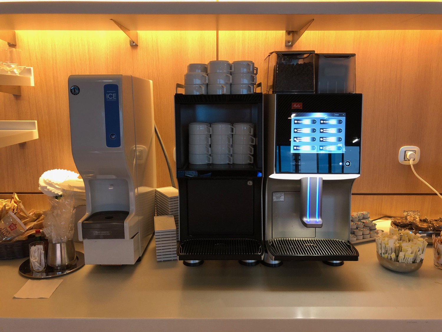 a coffee machine and coffee maker on a counter
