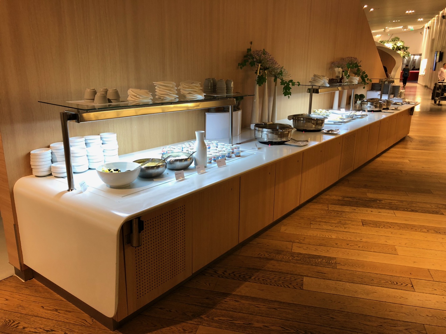 a buffet line with bowls and bowls on top