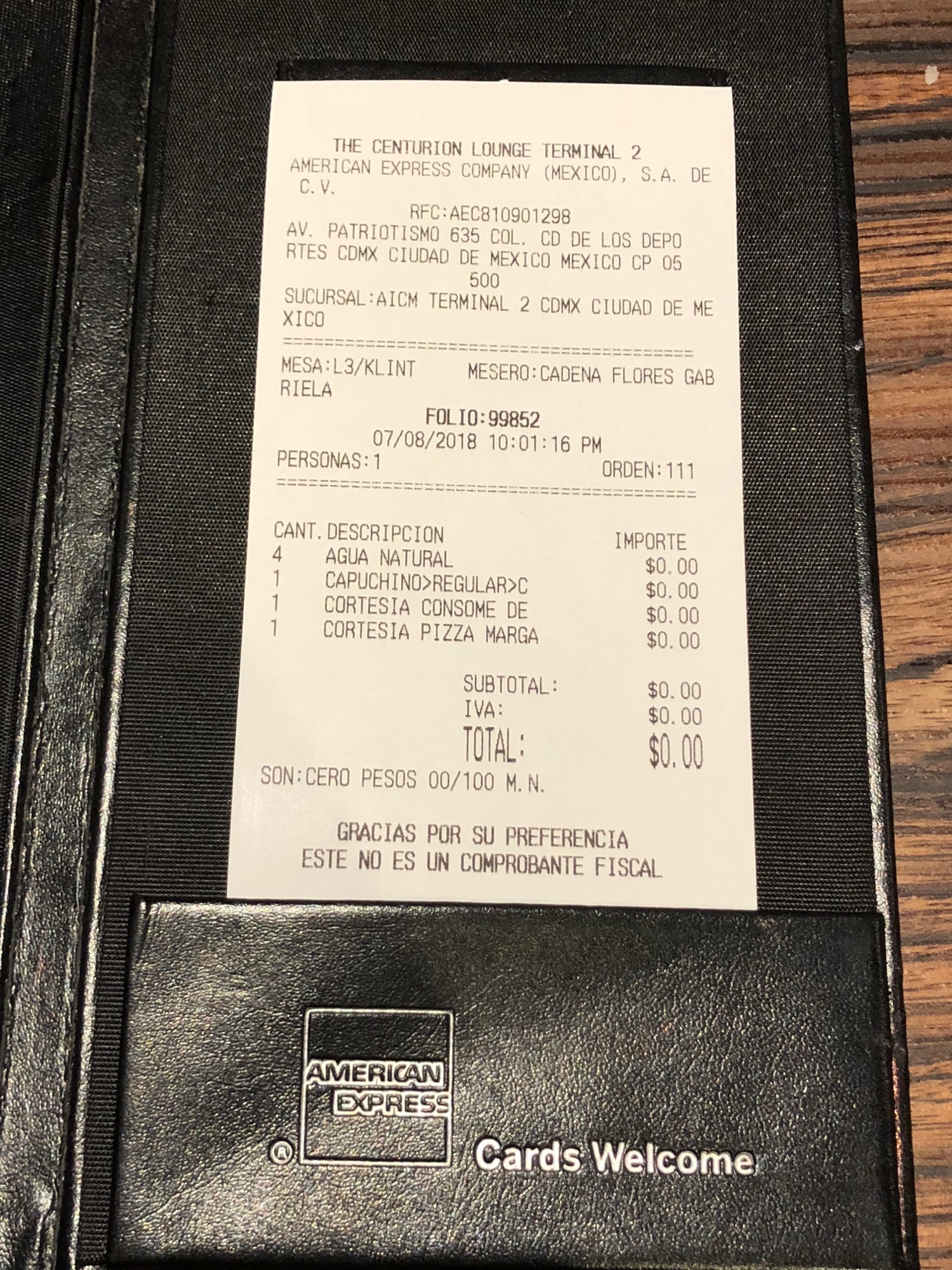 a black leather restaurant menu with white paper