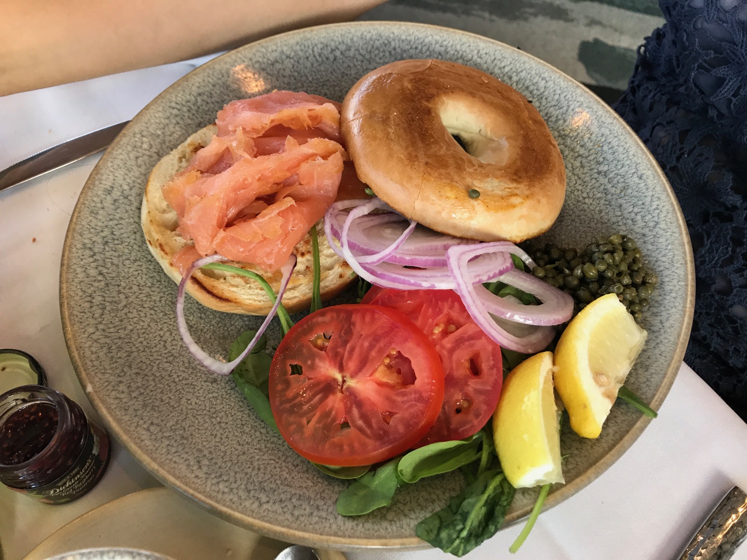 a plate of bagel and vegetables