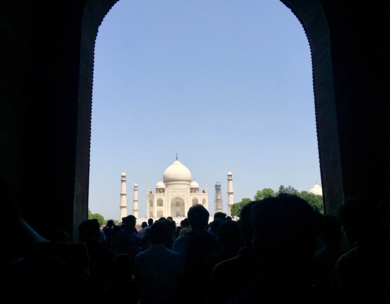 A glimpse of the Taj through a dark opening