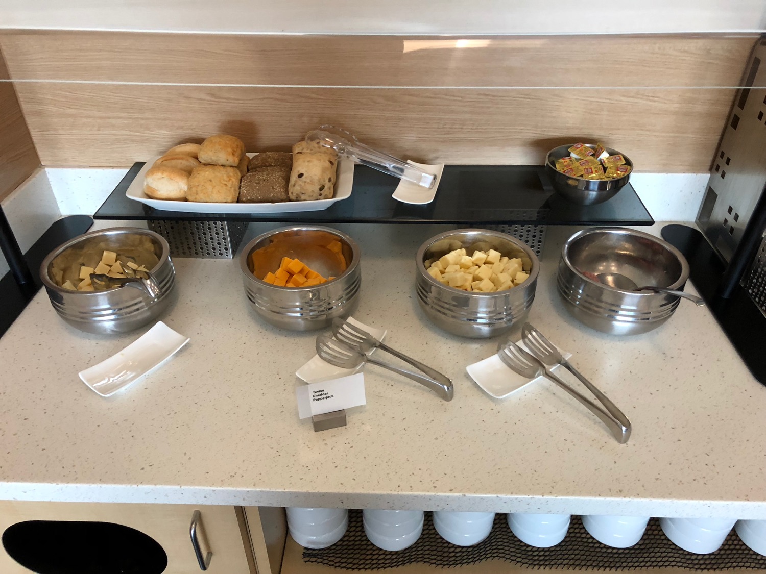 a buffet table with food and utensils
