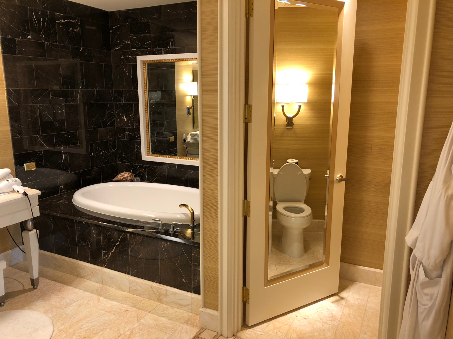 a bathroom with a bathtub and a mirror