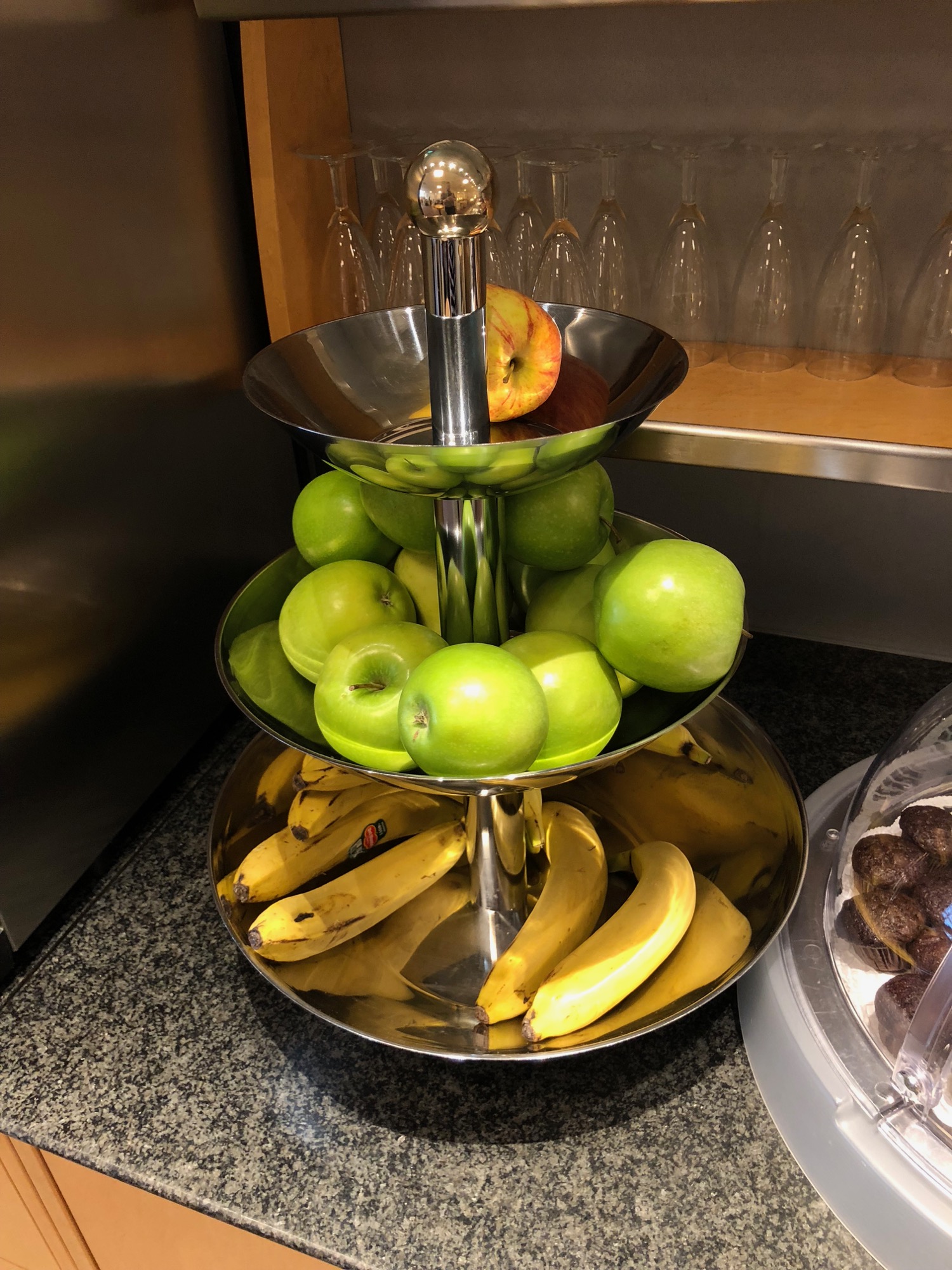 a three tiered tray with fruit on it