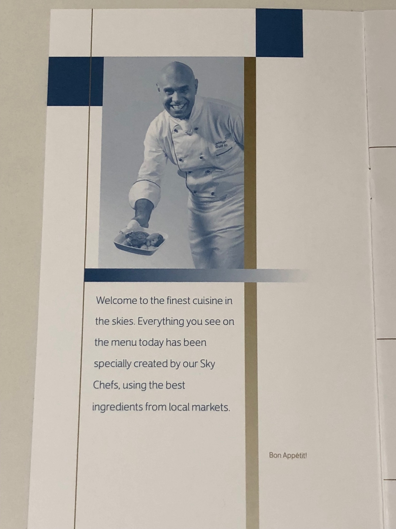 a menu with a picture of a man smiling